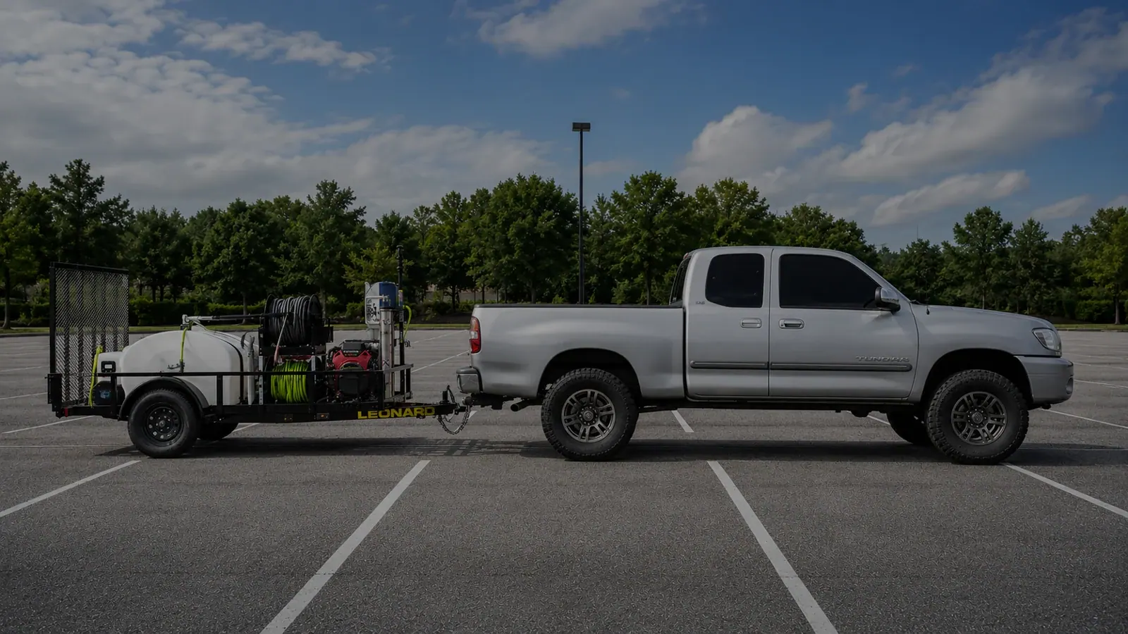 A Plus Exteriors truck and cleaning trailer
