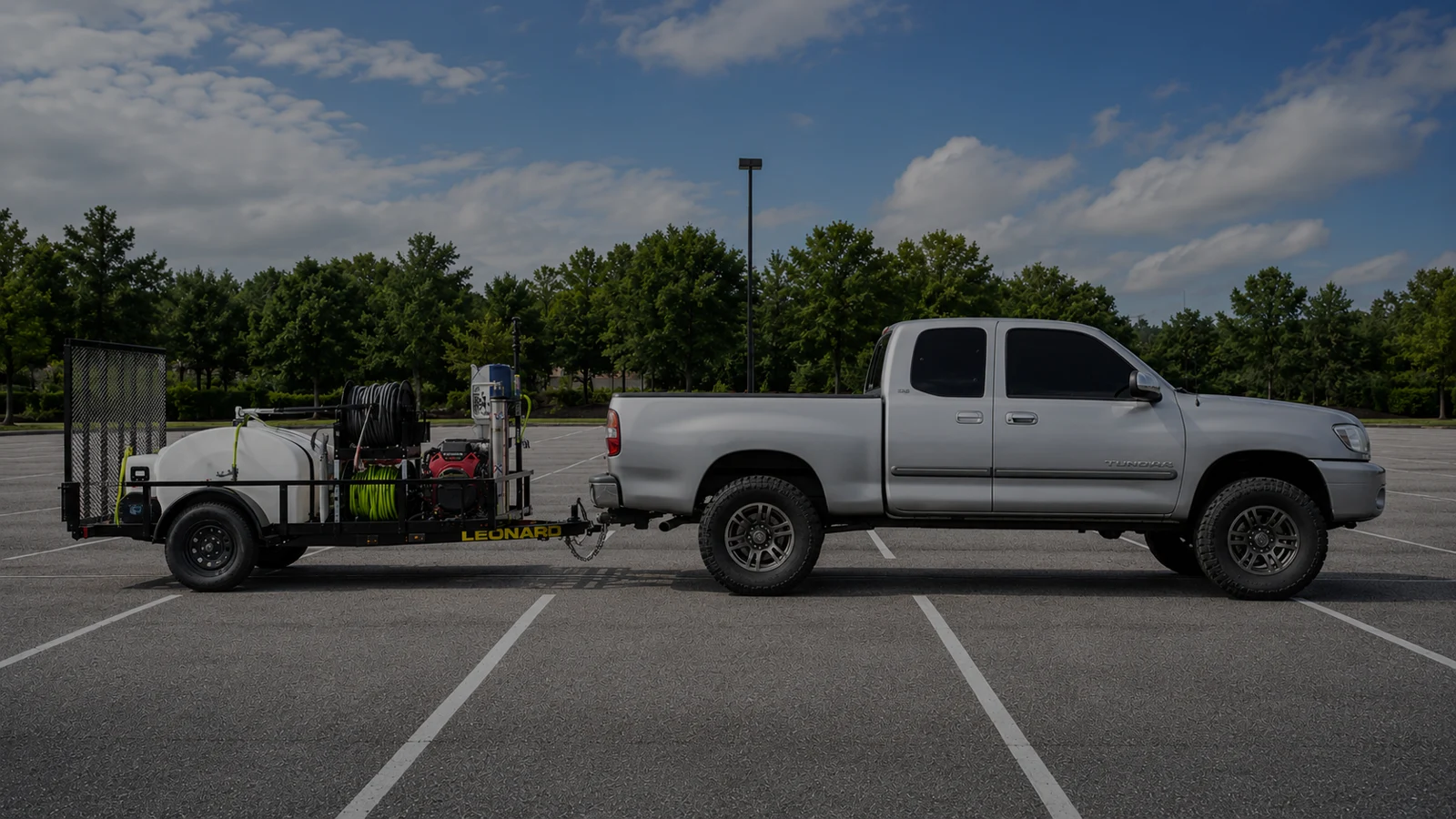 A Plus Exteriors truck and professional exterior cleaning trailer